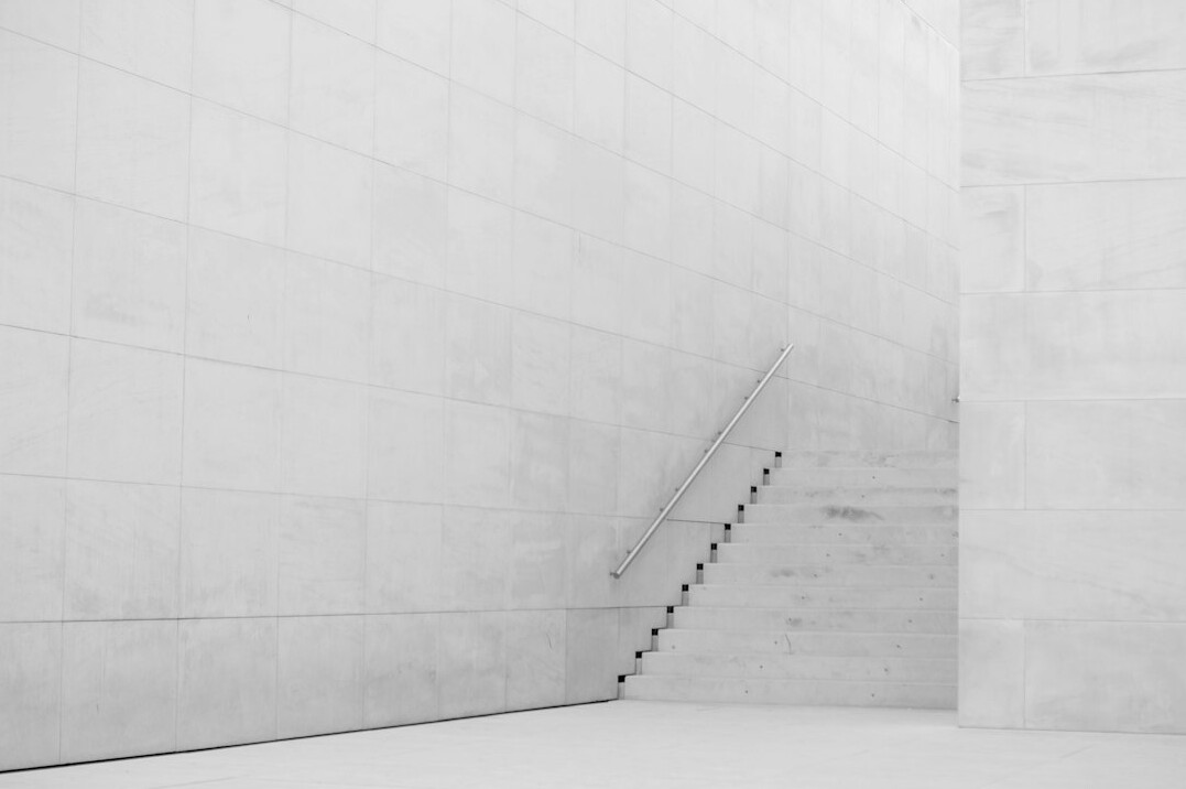 Minimalist concrete architecture with long soft shadows