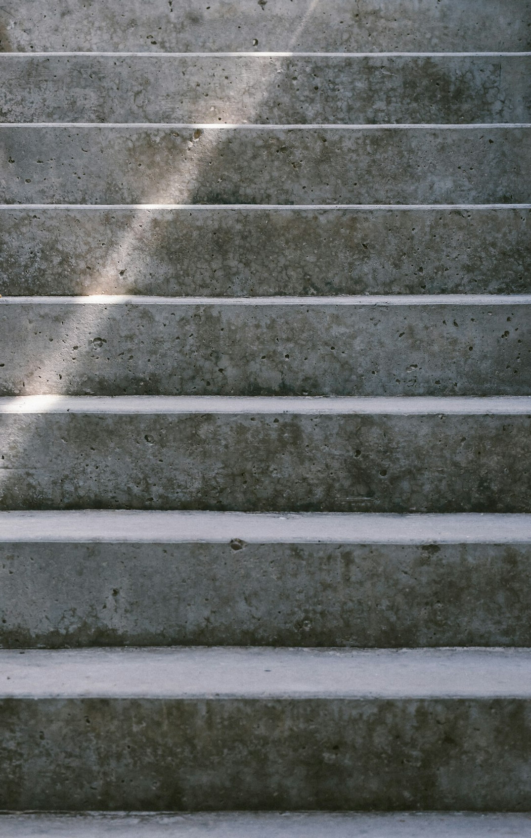 Stone staircase curving upward in soft light