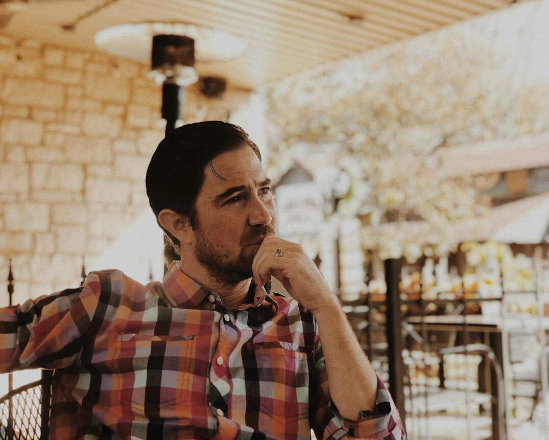person in thoughtful conversation