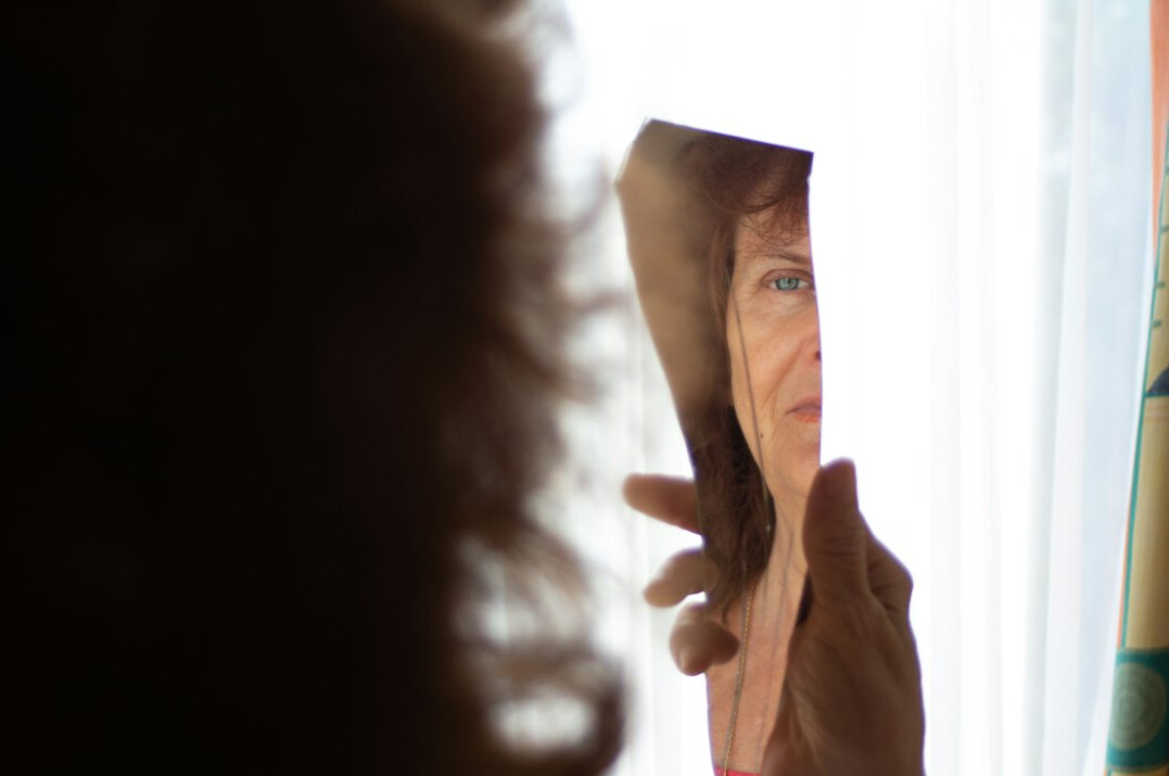 person reflecting in mirror